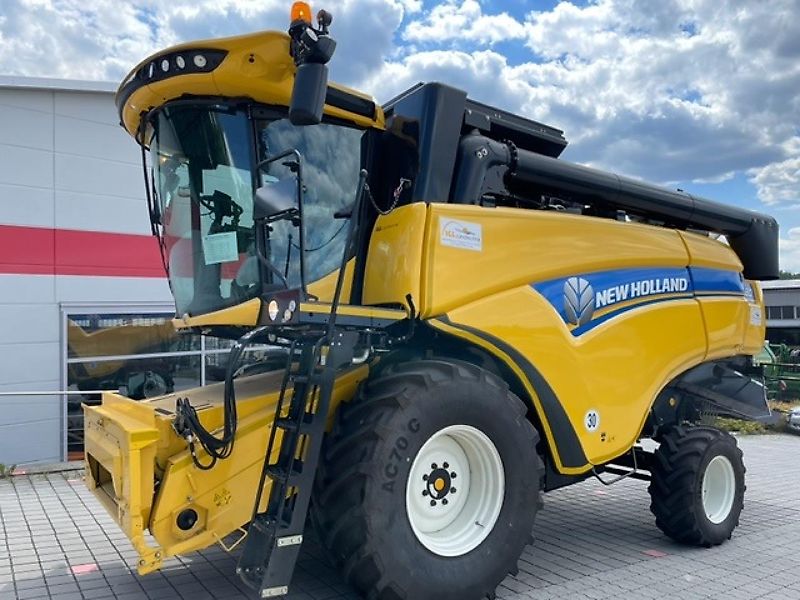 New Holland CX 5.80 inkl. 6,10m Varifeed & Wagen