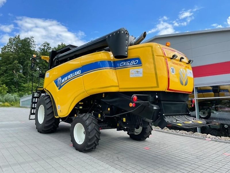 New Holland CX 5.80 inkl. 6,10m Varifeed & Wagen
