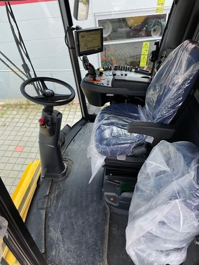 New Holland CX 5.80 inkl. 6,10m Varifeed & Wagen