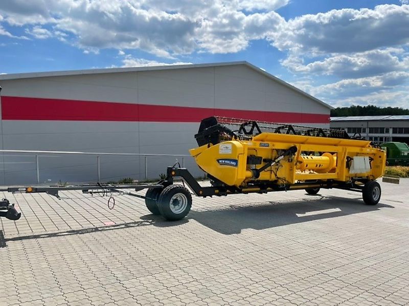 New Holland CX 5.80 inkl. 6,10m Varifeed & Wagen