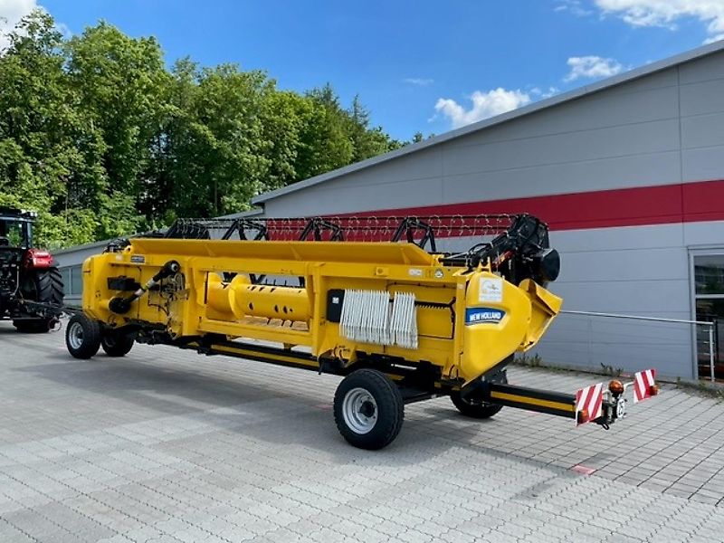 New Holland CX 5.80 inkl. 6,10m Varifeed & Wagen