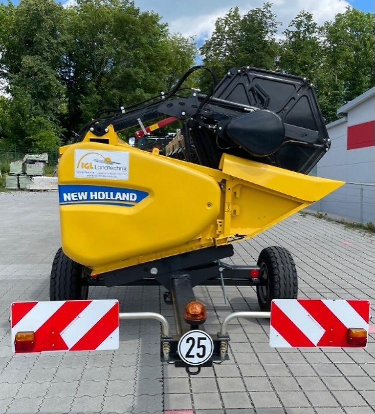 New Holland CX 5.80 inkl. 6,10m Varifeed & Wagen