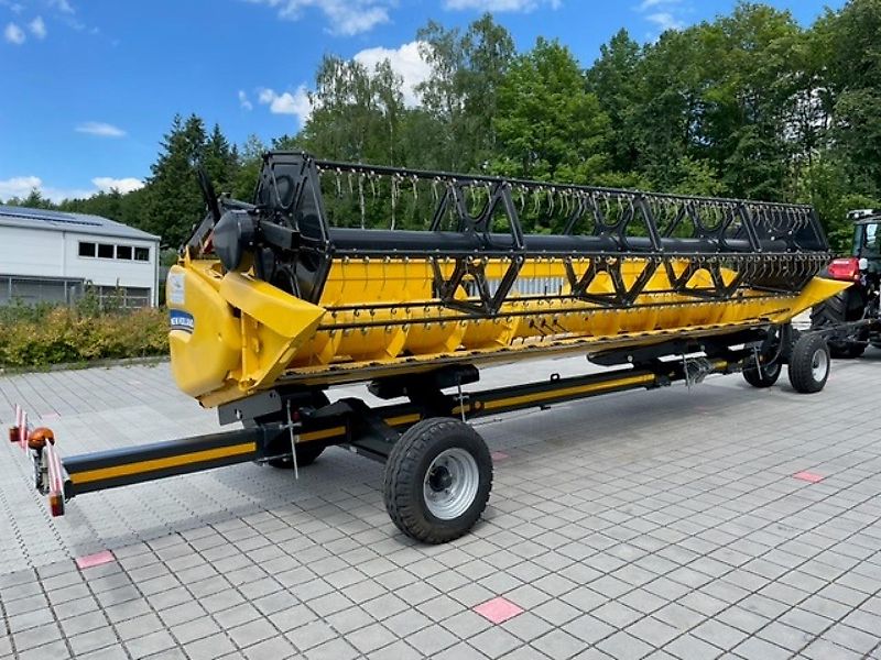 New Holland CX 5.80 inkl. 6,10m Varifeed & Wagen